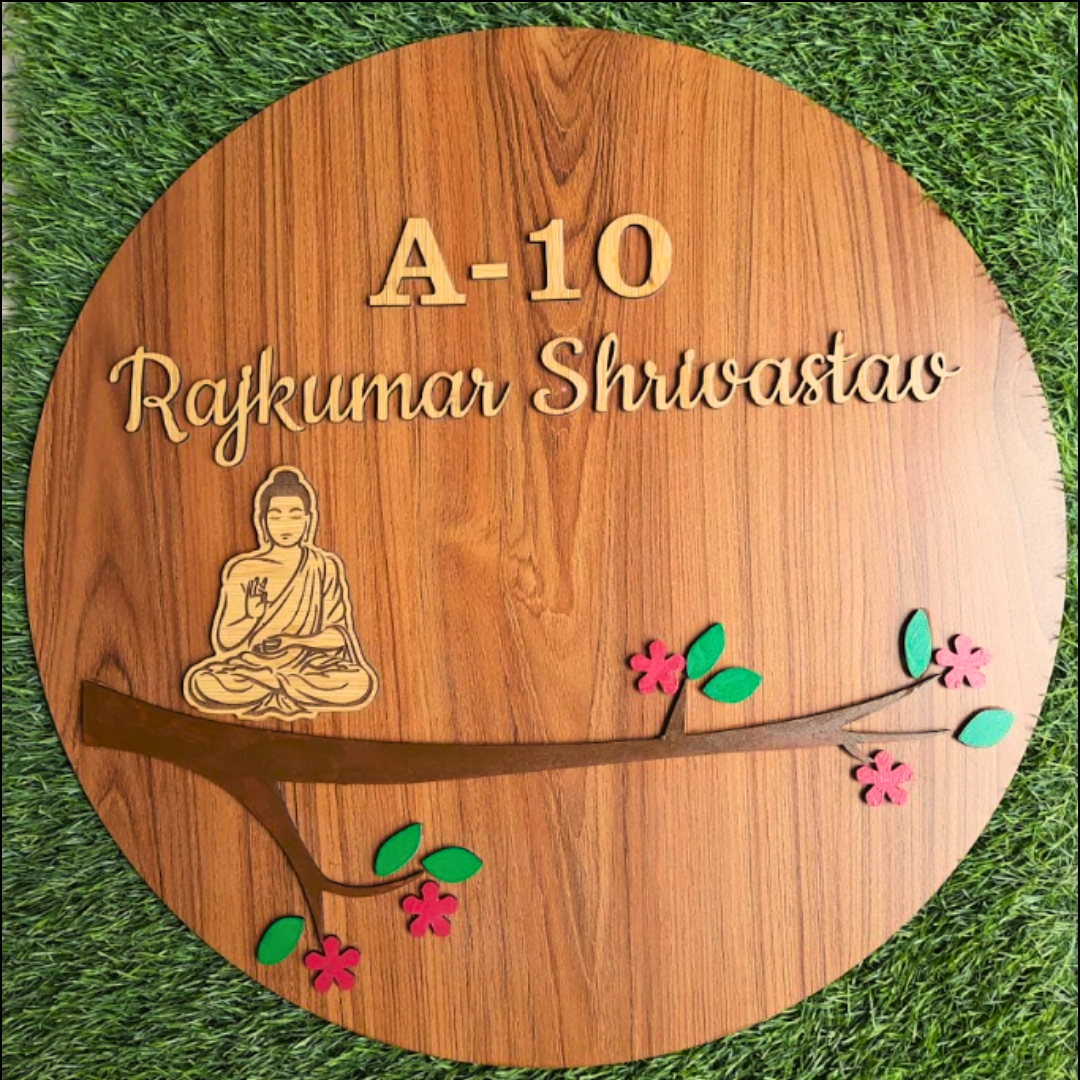 Personalized Gifting of Custom wooden nameplate featuring the name, with a serene Buddha illustration and floral design, set against a grassy background.