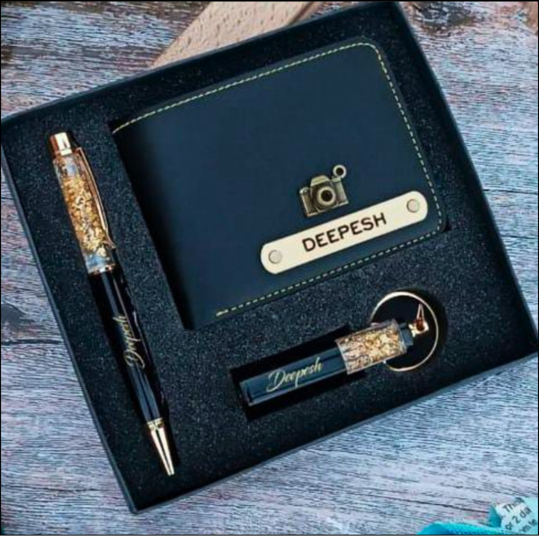 Personalized Gifting of men's gift combo box containing a men's leather wallet, a rollerball pen, and a key chain with the name printed on them.